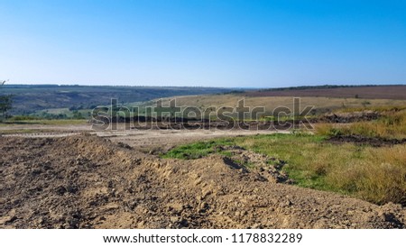 Hilly area for construction. Uncultivated land.