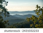 Hilly landscape of le Massif des Maures and the silouhette of chateau de Grimaud, in France, in Europe. 