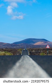 Hilly Road On Lanzarote  Car Far Away