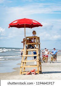 HILTON HEAD ISLAND, N.C./U.S.A. - JULY 31, 2018: A Photo Of A Female Lifeguard In A Beach Tower On Coligny Beach Park.