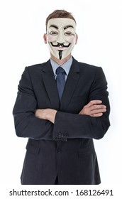 HILVERSUM, NETHERLANDS - MAY 20, 2013: Photo of Businessman wearing Vendetta mask. This mask is a well-known symbol for the online hacktivist group Anonymous. Also used by protesters.