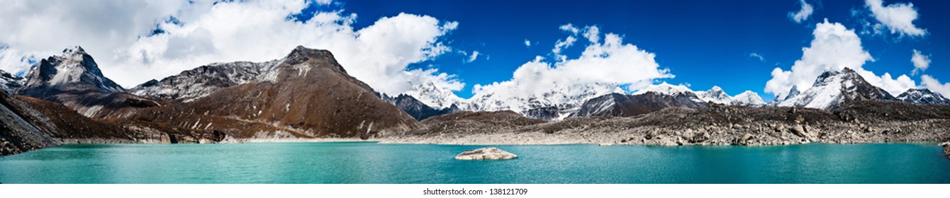 Himalaya panorama: sacred lake near Gokyo and Everest summit in the right part of the image. Travel to Nepal