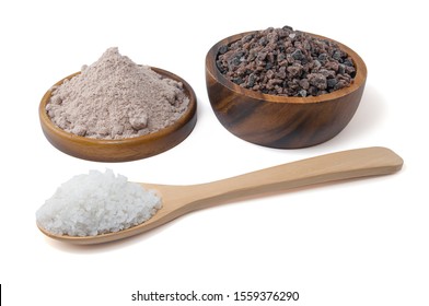 Himalayan black rock salt, Indian Black salt, Hawaiian Black Lava Salt  in a wooden bowl and wooden spoon isolated on white background with clipping path
