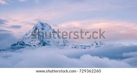himalayan mountain top above the clouds, annapurna, nepal