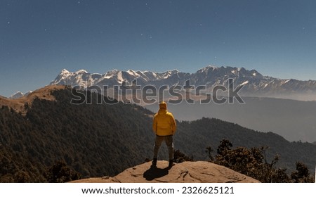 Himalayan peaks illuminated under the full moon during Brahmatal trek in Uttarakhand India