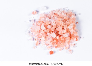 Himalayan Pink Salt Crystals Piled And Isolated On A White Background