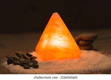 Himalayan pink salt lamp on table useful for asthma treatment Halotherapy