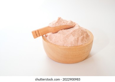 Himalayan pink salt powder in wooden bowl and scoop isolated on white background.  - Powered by Shutterstock