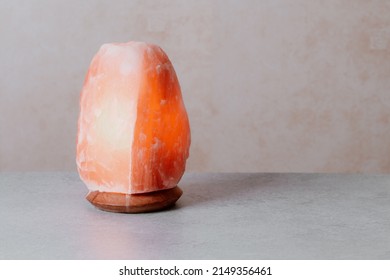 Himalayan Salt Lamp On Table, Stress Control, Calming Home Decor. Natural Salt Lamp To Reduce Stress And Purify Air