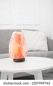 Himalayan Salt Lamp On White Table In Room