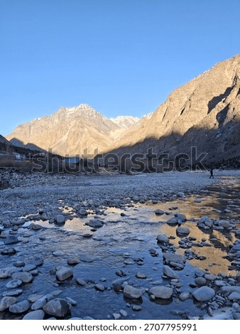 himalyas river view with sunlight falling on mountain 