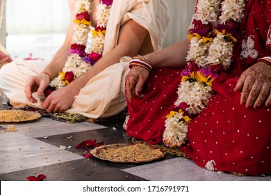 Hindu bride and groom with long garlands of flowers. Beautiful traditional Indian wedding ceremony. Hindu wedding. indian engagement. Hindu the Vedic Yagya ceremony. Indian vivah Yajna.