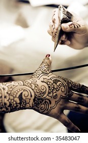 A Hindu Bride has Henna applied to her hands