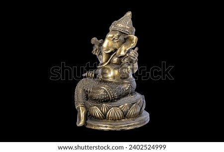 Hindu God Ganesh (Ganesha) Statuette, isolated on a black background