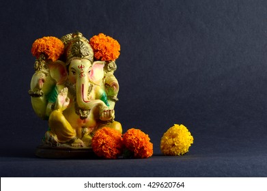 Hindu God Ganesha. Ganesha Idol On Grey Background.
