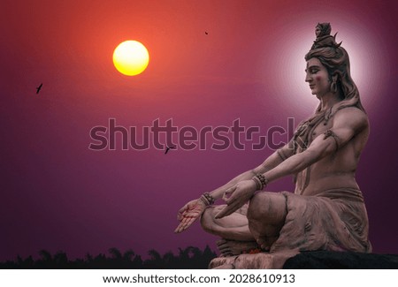Hindu god Shiva sculpture sitting in meditation