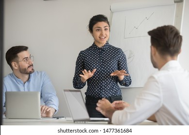 Hindu lady ceo negotiates with investors in boardroom. Business trainer give presentation explanation to company staff at seminar, corporate assistant provide information engaging participants concept