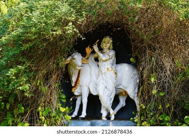 Hindu Lord vishnu with his his cow and bansuri