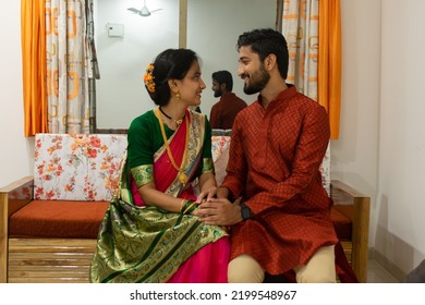 Hindu Marathi Young Couple Smiling, Looking At Each Other In Indian Traditional Festival Clothes In Their New Home. Home Loan, Health Insurance, House Warming Party, Family, Love, Anniversary, Cuddle