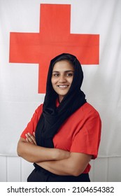 Hindu Woman Volunteer Stands In A Red Shirt