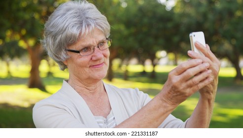 Hip Grandma Taking Selfies At The Park