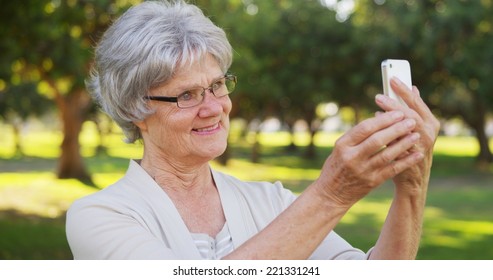 Hip Grandma Taking Selfies At The Park