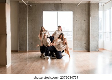 hip hop dance crew in the studio, synchrone moves of modern dances - Powered by Shutterstock