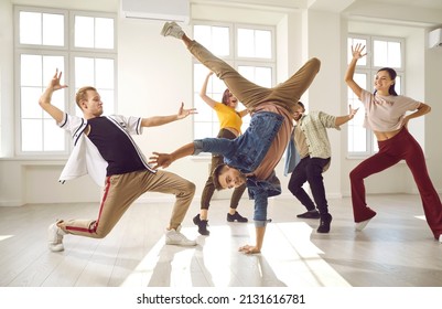 Hip Hop Dancers In Dance Studios. Young People Who Practice Modern Dance Styles Have Fun And Dance Together In Spacious Bright Hall. Cheerful, Talented And Active Dancers In Casual Clothes.