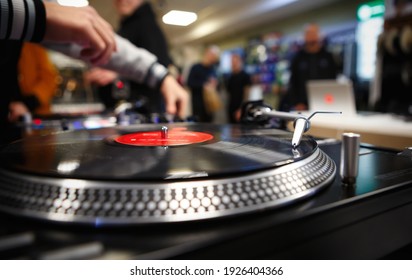 Hip Hop Dj Plays Music With Turntables.Professional Disc Jockey Plays Musical Tracks With Analog Turn Table Player 