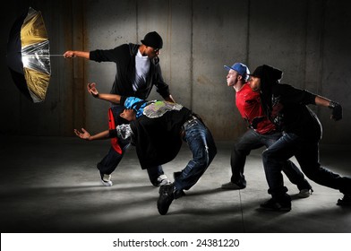 Hip Hop Men Performing And Act Over An Urban Background