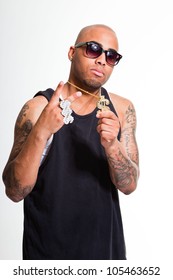 Hip Hop Urban Gangster Black Man Wearing Dark Shirt And Golden Jewelry Isolated On White. Looking Confident. Cool Guy. Studio Shot.