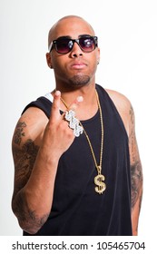 Hip Hop Urban Gangster Black Man Wearing Dark Shirt And Golden Jewelry Isolated On White. Looking Confident. Cool Guy. Studio Shot.