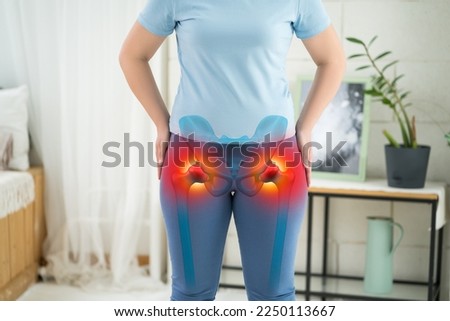 Hip joint pain, woman suffering from osteoarthritis at home, health problems concept