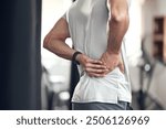 Hip pain, man and fitness injury at gym for boxing, sport and training with accident at health center. Wellness, hands and exercise of an athlete with hurt joint and scoliosis concern of spine