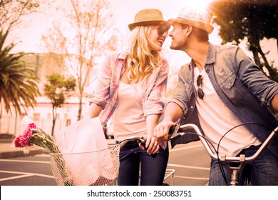 Hip Young Couple On A Bike Ride On A Sunny Day In The City