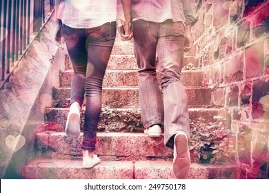 Hip Young Couple Walking Up Steps On A Sunny Day In The City