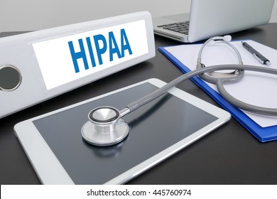 HIPAA folder on Desktop on table. ipad