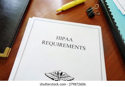 HIPAA Requirements healthcare privacy document on an office desk                               