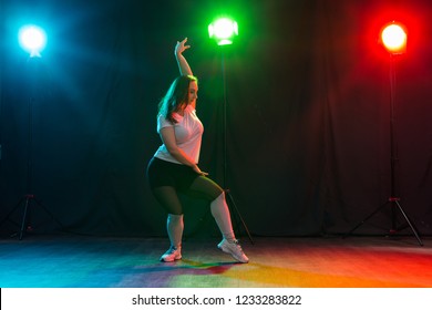 Hip-hop, jazz-funk, tecktonik, waacking, trance and street dances concept - Pretty woman dancing jazz funk over dark background