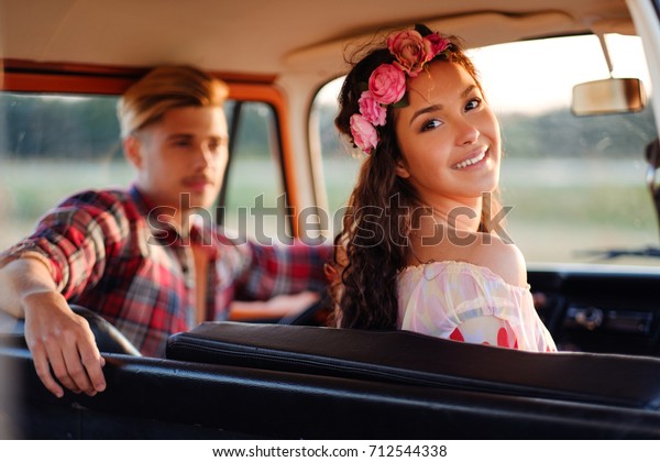 Hippie couple in a van on\
a road trip