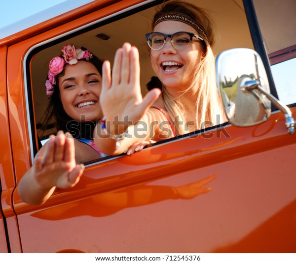 Hippie friends in a van\
on a road trip
