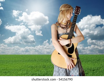 hippie girl with the guitar on openair rock festival