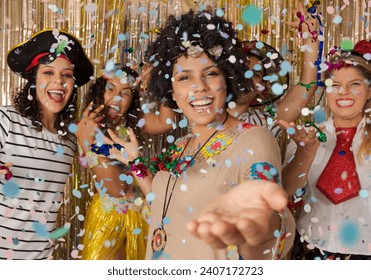 Hippie woman welcomes guests to the Carnival party in Brazil. Dressed group of brazilian friends enjoying Carnival Party and throwing confetti.