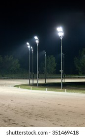 Hippodrome With Empty Dirt Track At Night.