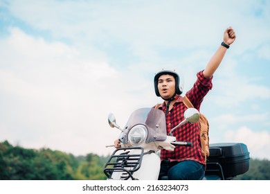 Hipster backpacker riding a motor scooter on road. Travels by scooter slow life on vacation resting time. - Shutterstock ID 2163234073