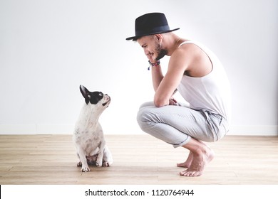 Hipster Boy With Hat Chatting With His French Bulldog Dog