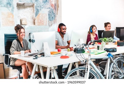 Hipster Business People Having Fun Working On Computer At Coworking Space Office - Modern Web Start Up Concept About Happy Productive Attitude - Bright Vivid Contrast Filter With Focus On Left Woman