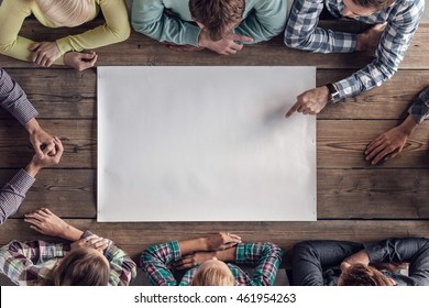 Hipster Business Teamwork Brainstorming Planning Meeting Concept, People Sitting Around The Table With White Paper