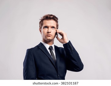 Hipster Businessman With Smartphone Making Phone Call. Studio Sh