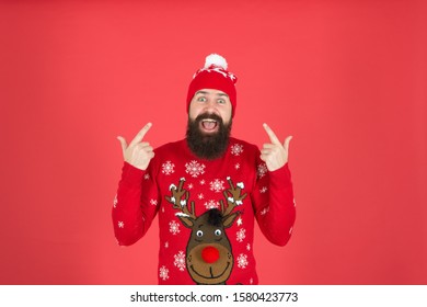 Hipster Cheerful Bearded Man Wear Winter Sweater And Hat. Happy New Year. Join Holiday Party Craze And Host Ugly Christmas Sweater Party. Feeling Awesome. Buy Festive Clothing. Sweater With Deer.